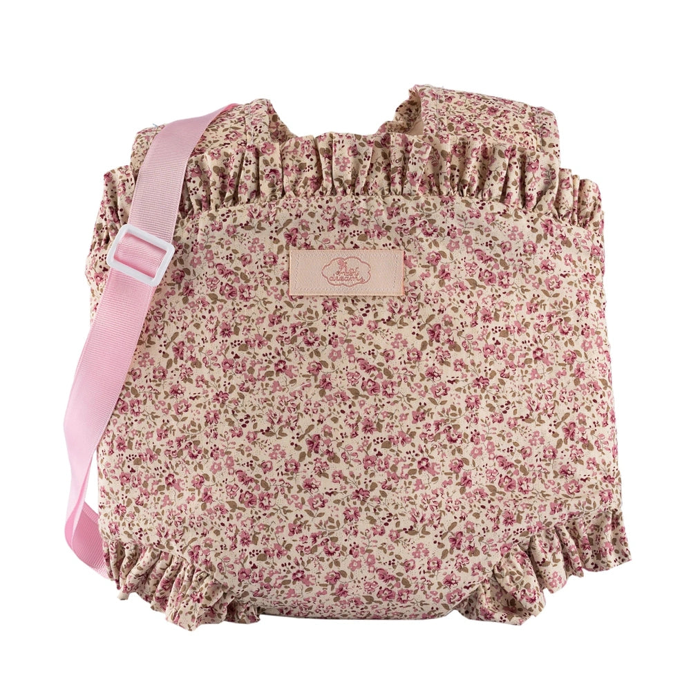 Floral baby carrier with pink ruffled edges and strap, designed for dolls 30-46 cm from the ASI Dolls Martina Collection.
