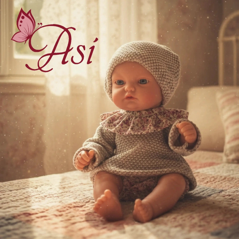 Asi Dolls Gordi Baby Outfit displays a pastel-dressed baby doll on a cozy bed, set in a warm and tranquil room.