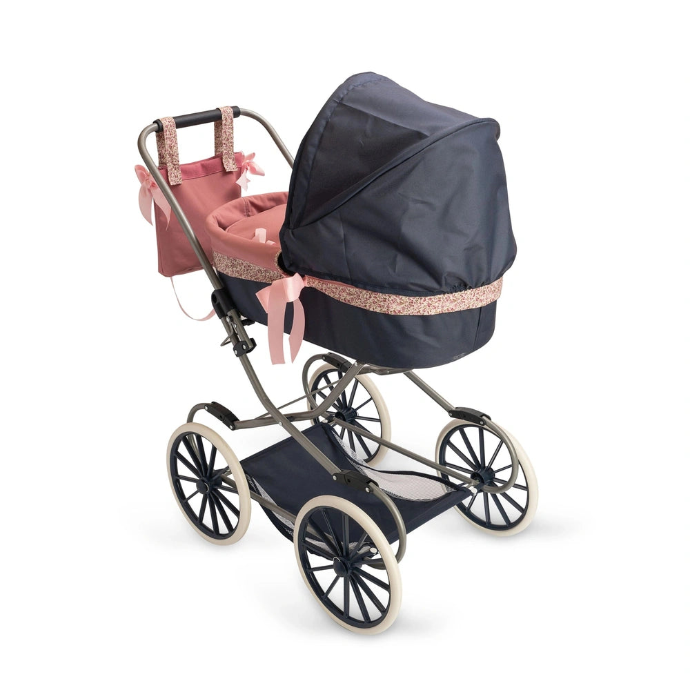 Luxurious doll stroller with navy hood, pink interior, floral trim, and elegant design, perfect for imaginative play.