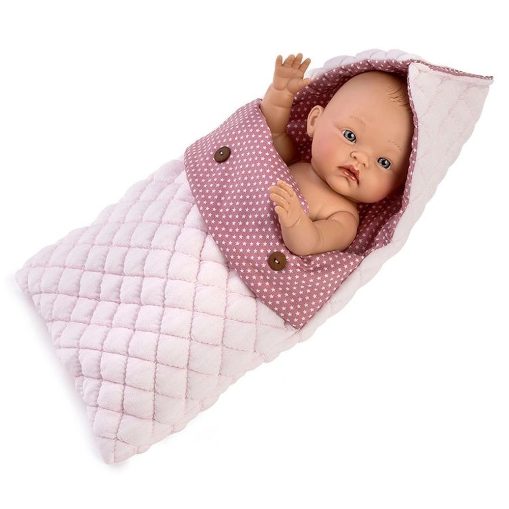 ASI Doll in a medium pink sleeping bag with white stars, quilted texture, and button details.