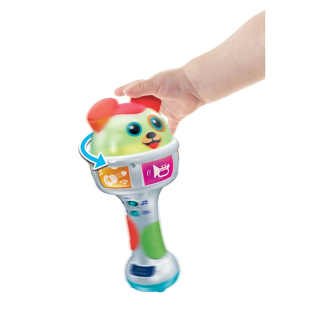 Baby Maracas Amici Cuccioli toy held in a hand, featuring colorful designs, buttons, a screen, and a friendly face.