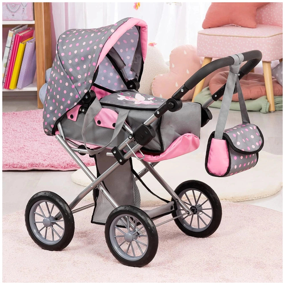 BAYER DESIGN Dolls Pram City Star features a metal frame, pink polka dot fabric, and black wheels on a pink carpet backdrop.