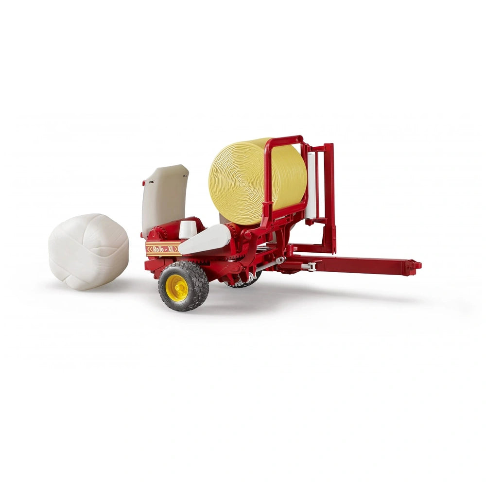 Red and yellow Bruder bale wrapper toy with round bales, simulating farm equipment.