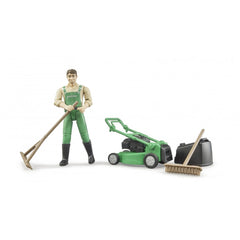 Gardener in green overalls with lawnmower, broom, and rake from Bruder bworld playset.