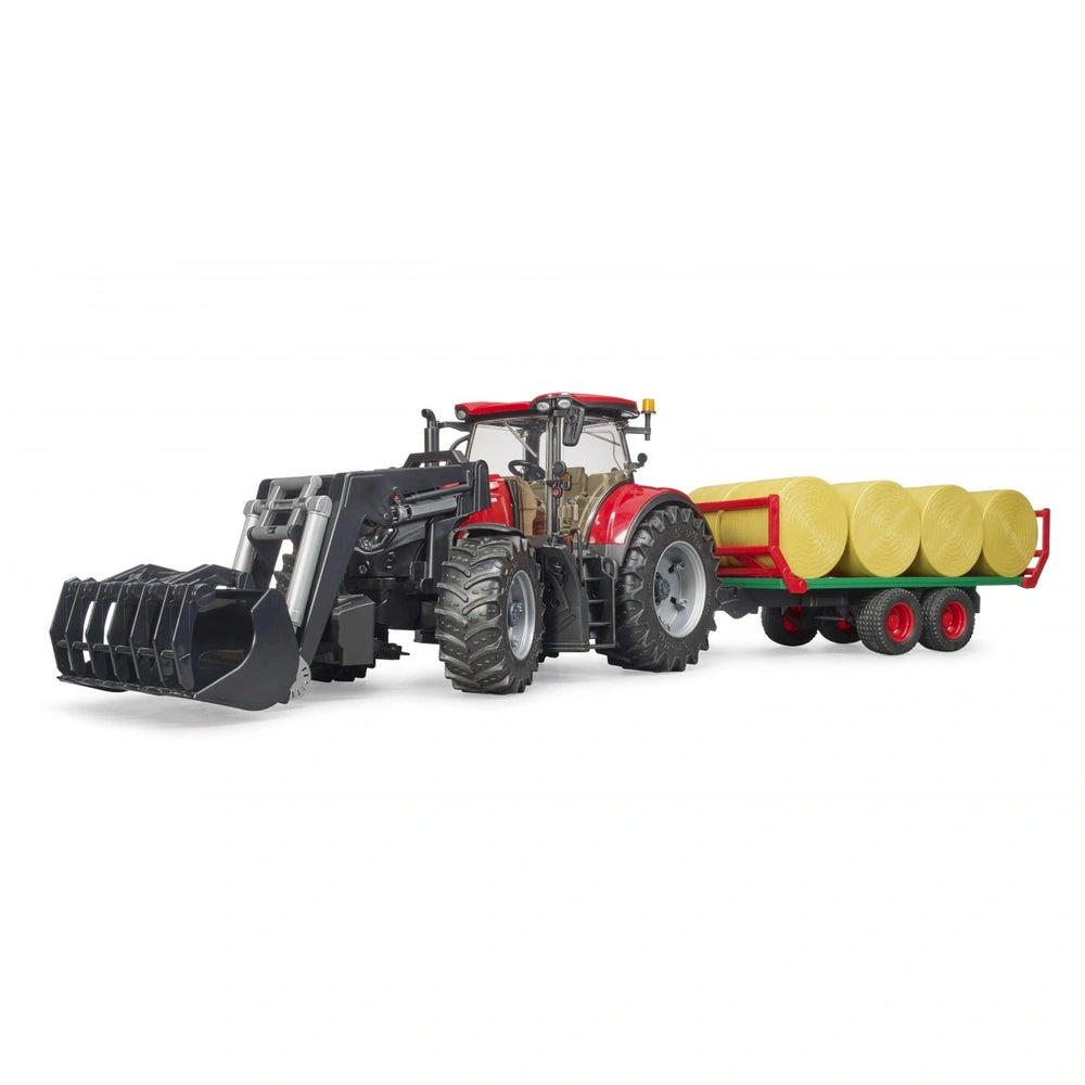Red Bruder Case IH Optum 300CVX toy tractor with front loader and yellow bales on trailer, 1:16 scale.