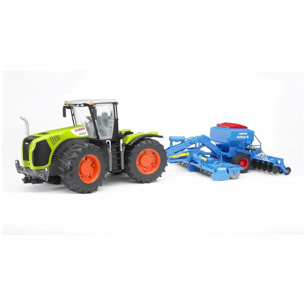 Claas Xerion 5000 toy tractor with realistic green and orange design, towing a blue agricultural implement.