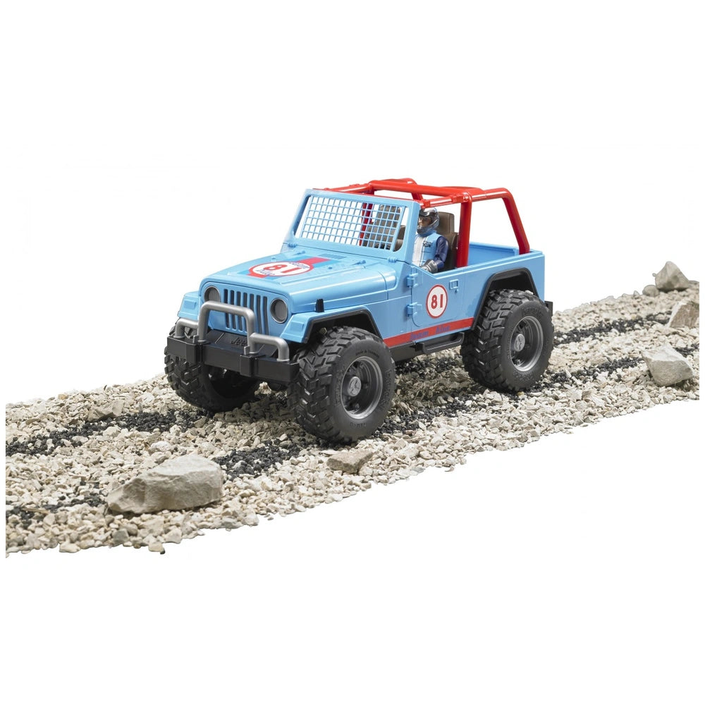Blue Bruder Jeep Cross Country Racer with driver, red roll cage, number 81, driving on rocky terrain.