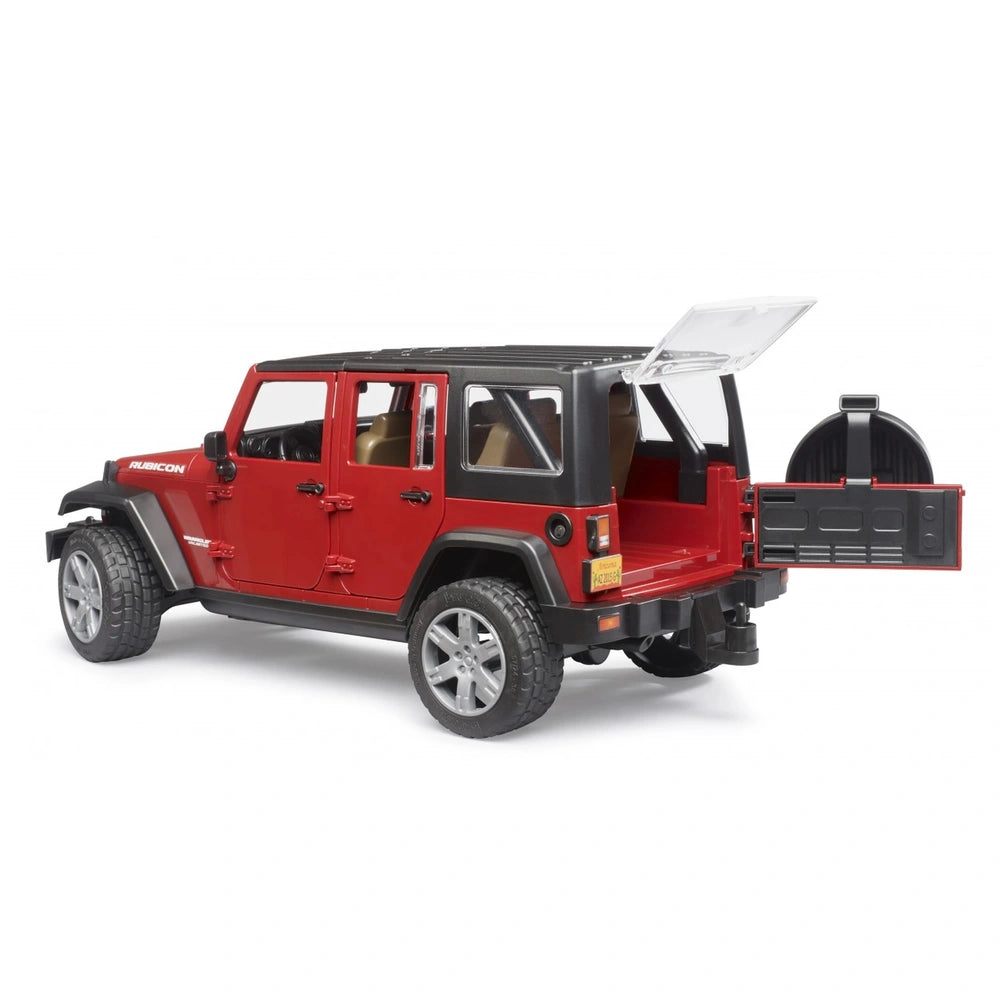 Red Bruder Jeep Wrangler toy with open trunk and realistic off-road features, showcasing rugged tires and detailed design.