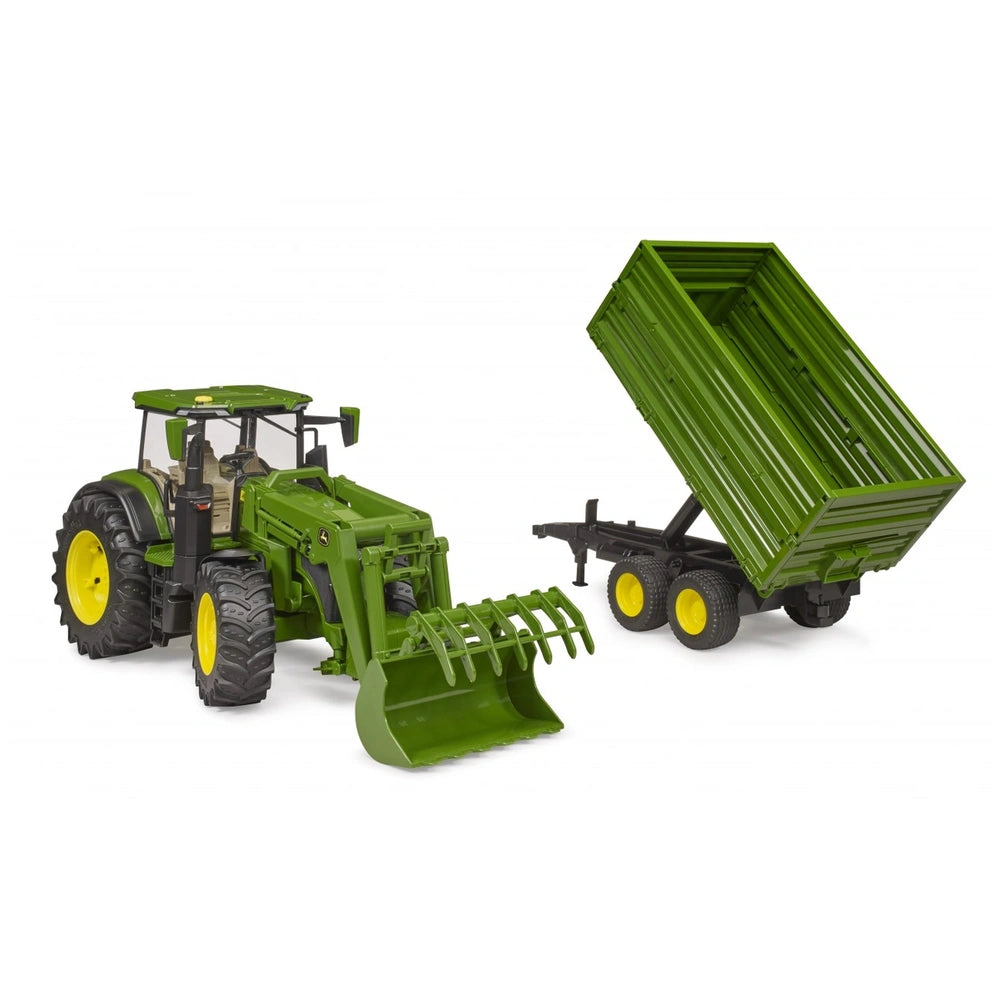 Green John Deere 7R 350 toy tractor with front loader and tandem axle tipping trailer on white background.