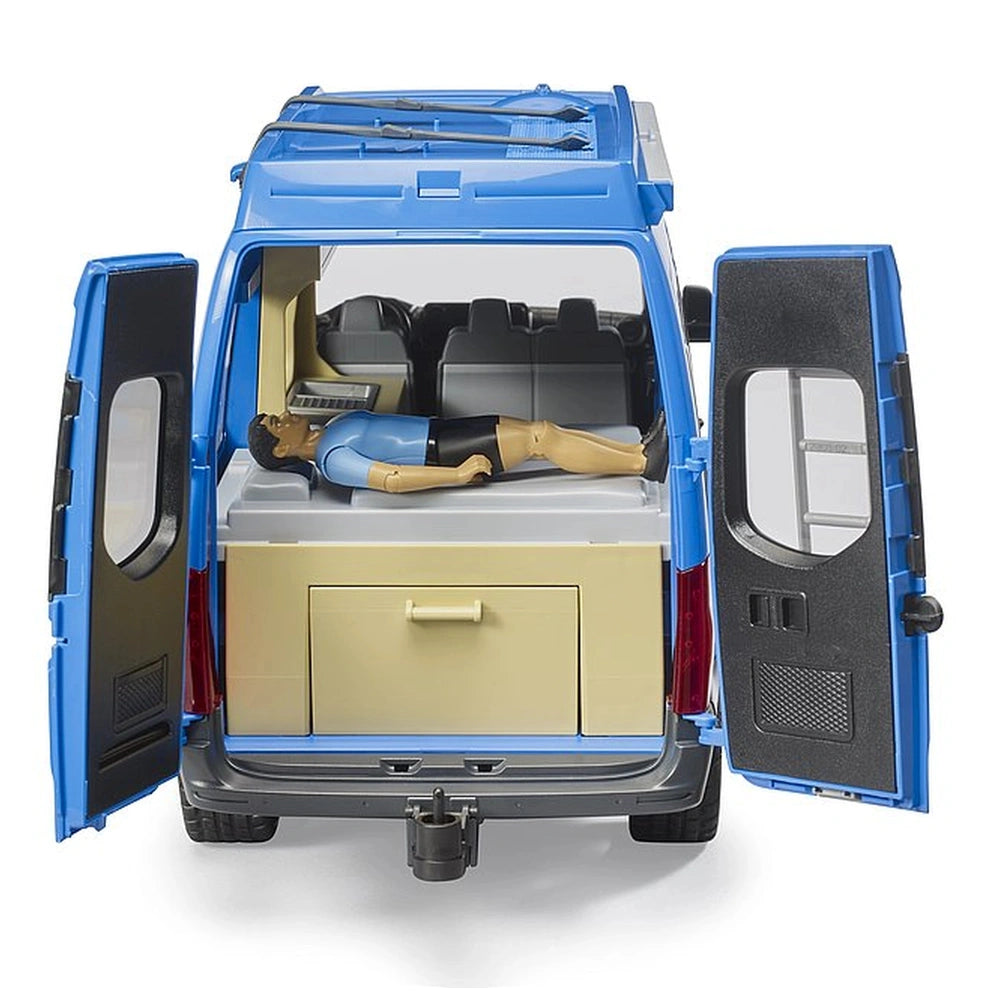 Blue MB Sprinter camper toy with open doors, revealing a driver figure lying on a double bed and a storage compartment.