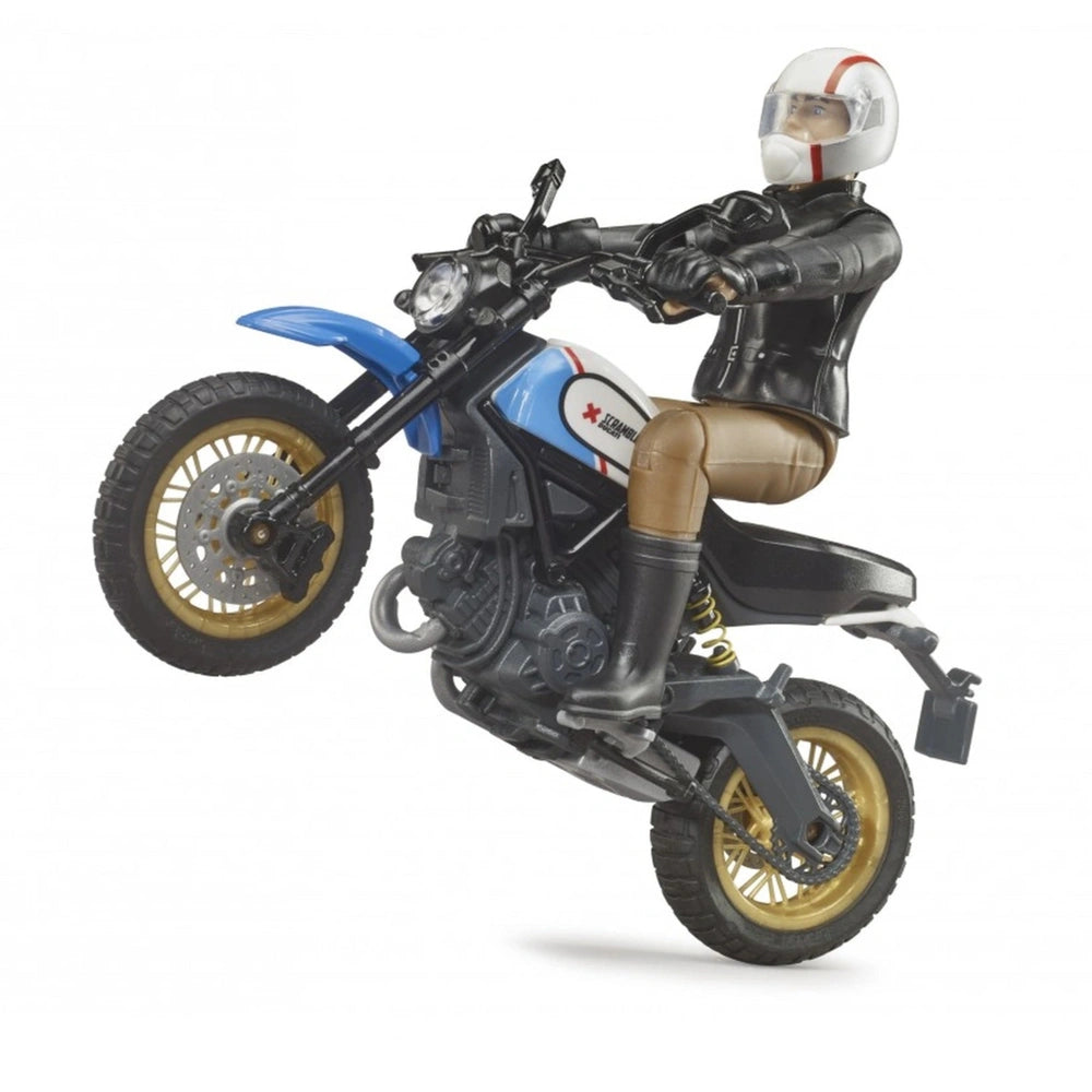 Bruder Scrambler Ducati Desert Sled toy with rider performing a wheelie, showcasing blue and gold detailing.