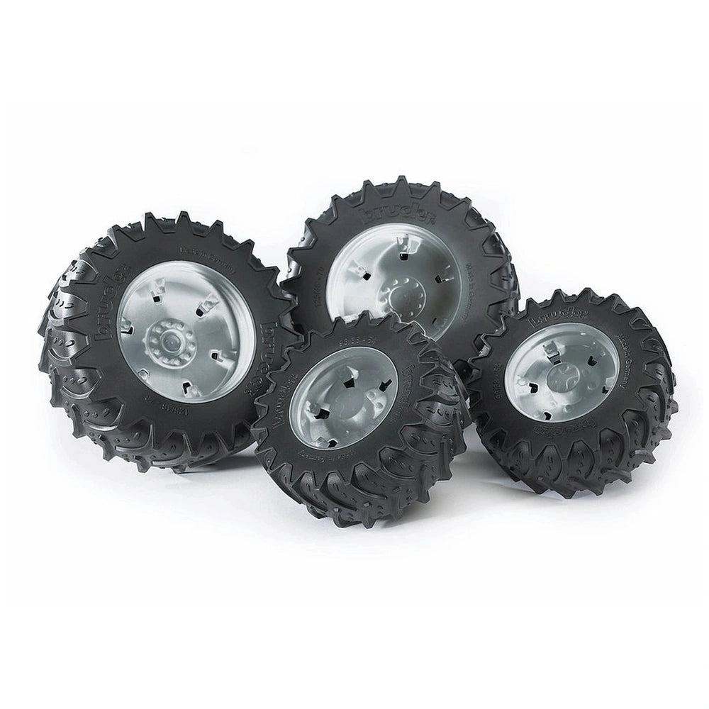 Twin black rubber tyres with silver hubs, designed for Bruder 3000 Series play vehicles, showing robust tread pattern.