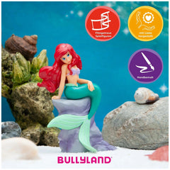 Bullyland Disney Ariel toy figure showcases a green tail, red hair, and blue bikini, packaged for retail display.
