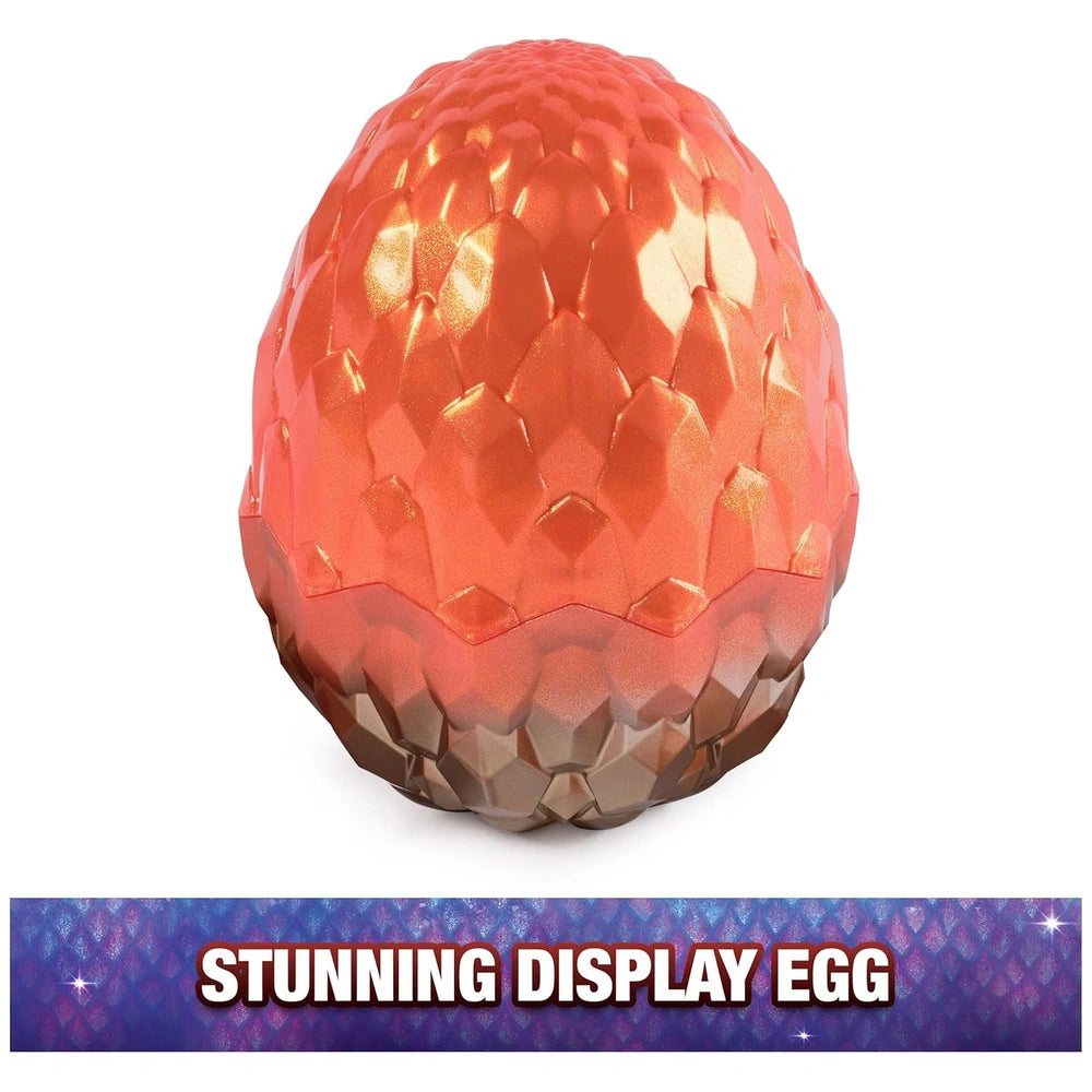 Articulated dragon figure collectible features a glossy orange egg with a scale-like texture against a light background.