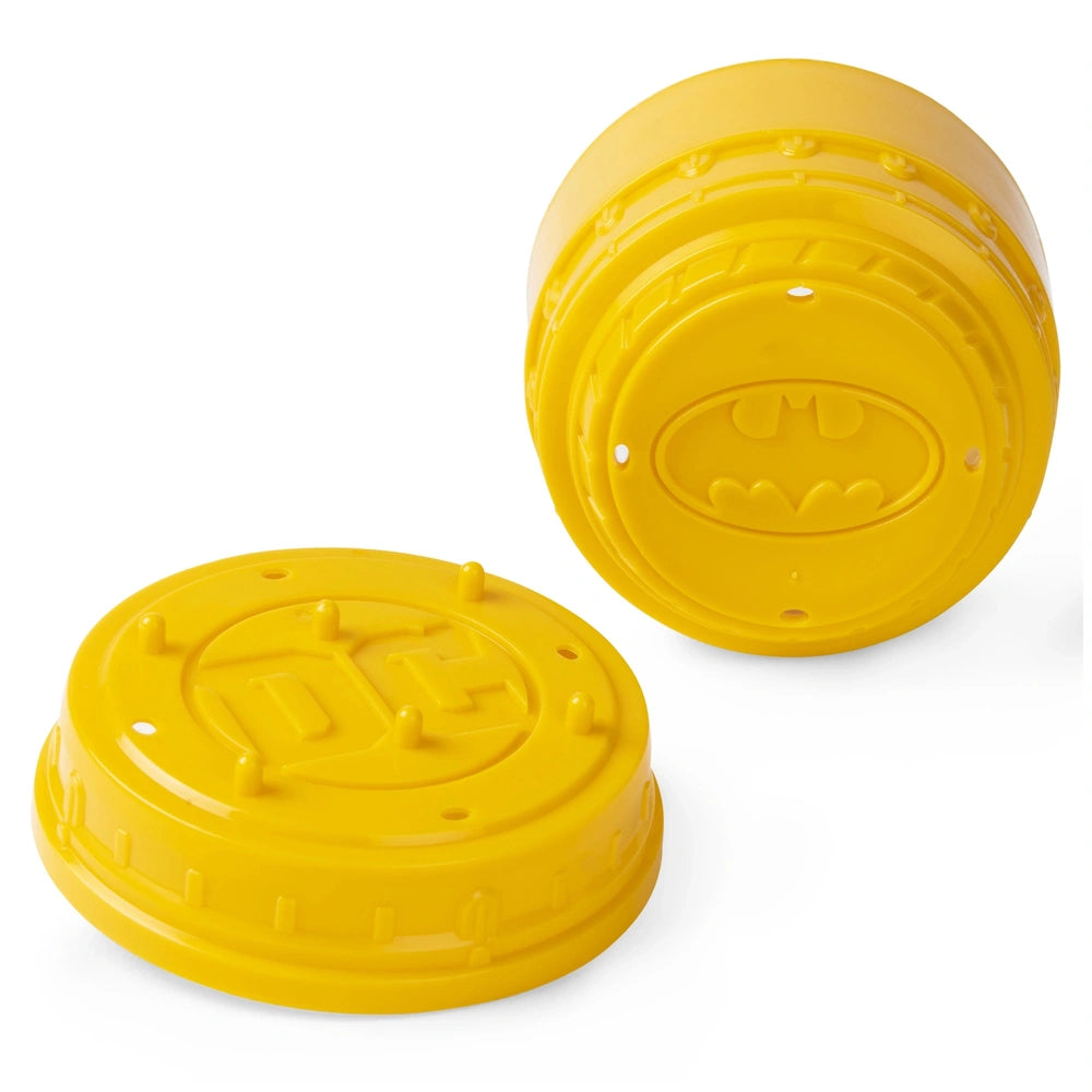 Bright yellow plastic caps designed to fit on bottle tops, displayed on a flat surface against a white background.