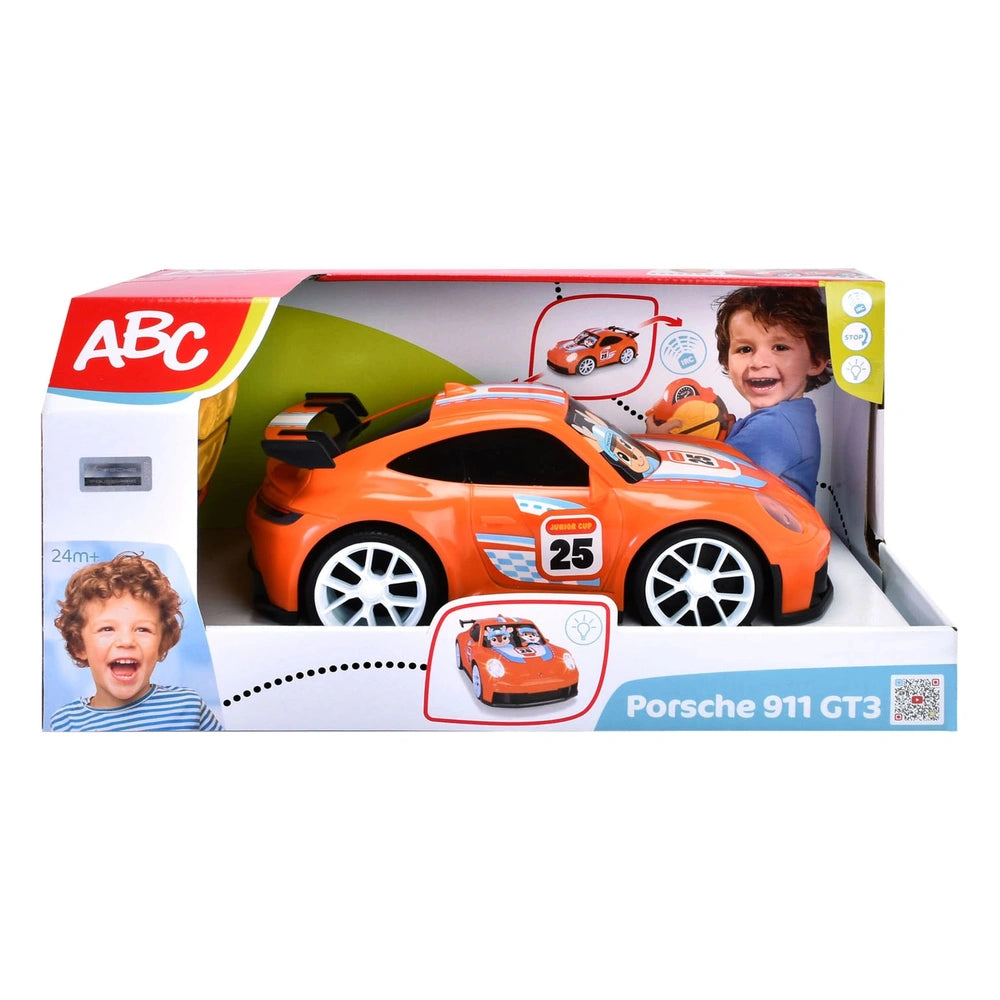 Dickie ABC remote-controlled Porsche 911 GT3 play vehicle packaging features an orange car and a child's image on a white bac