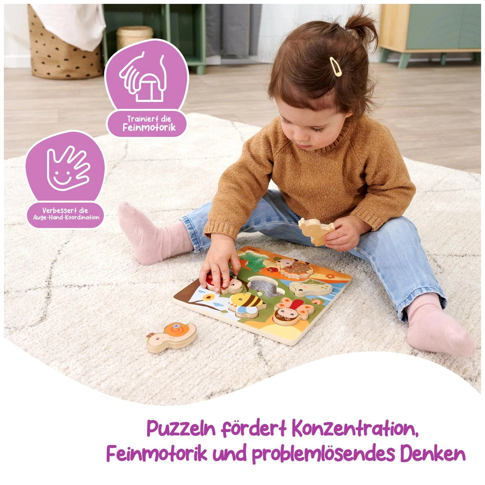 Eichhorn Bee-Happy Sensory Puzzle is being explored by a focused child on a shaggy rug, showcasing vibrant colors and engagin