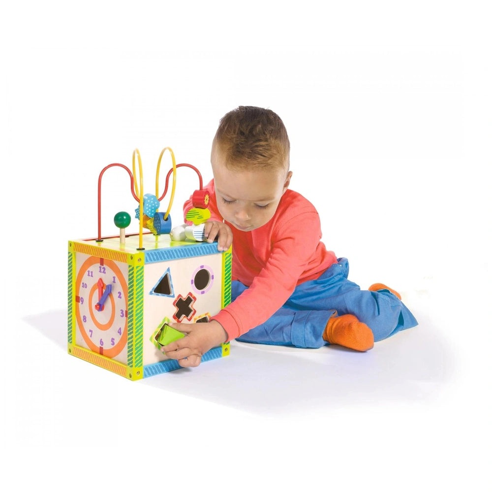 Eichhorn Color Little Play Center features a young child in a red top and blue pants engaging with a colorful, educational to