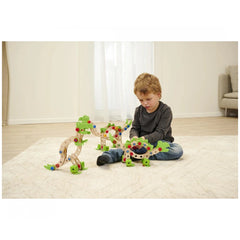 Eichhorn Constructor Dinosaur construction set with a child holding a colorful wooden toy on a textured white surface.