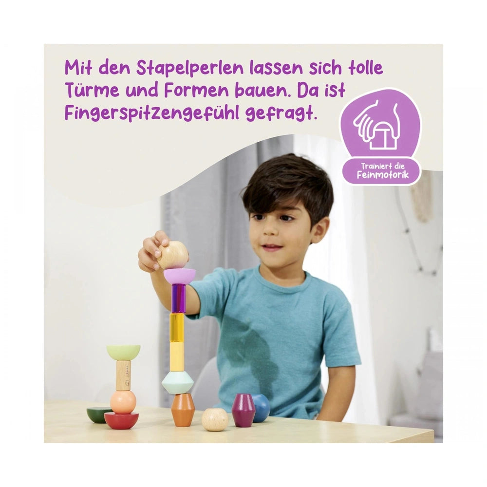 Eichhorn Montessori Stackable Beads showcase a boy building colorful towers, enhancing his finger dexterity skills.