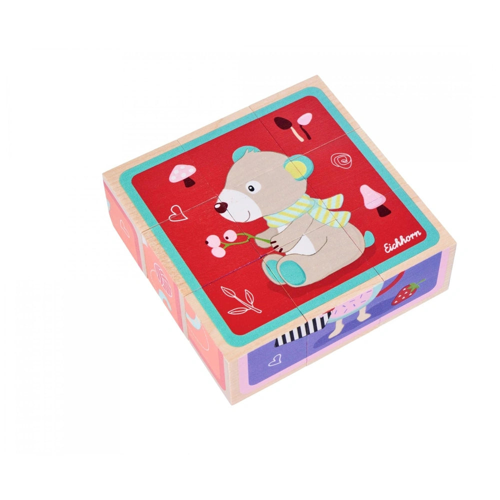 Eichhorn Picture Cube Friends, a colorful 9-piece puzzle featuring a friendly teddy bear and playful illustrations.