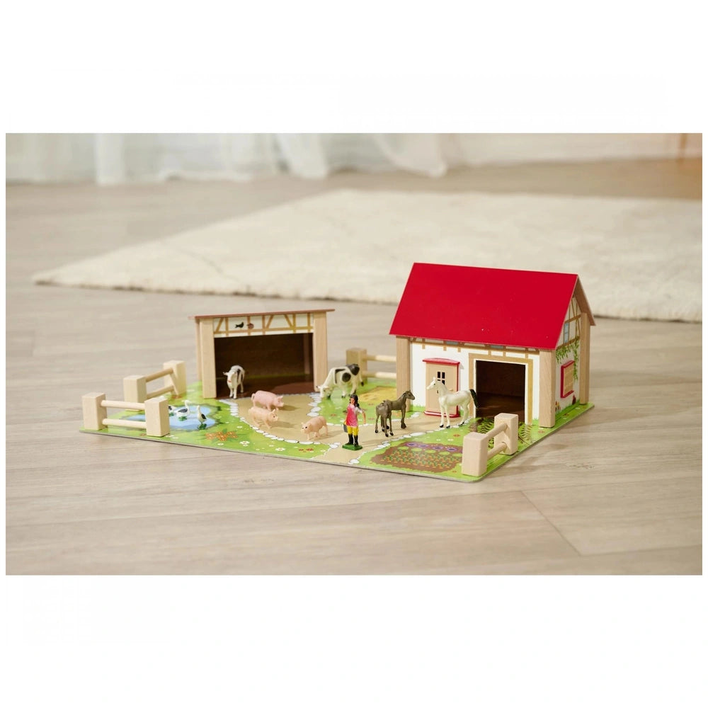 Eichhorn Wooden Farm playset features a barn and playhouse with animal figures, designed for imaginative play.