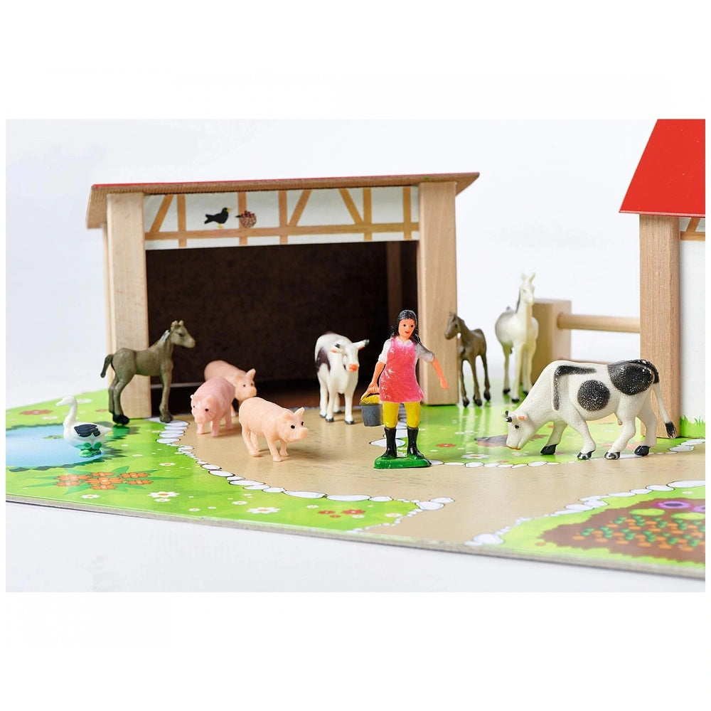 Eichhorn wooden farm playset with 20 accessories, including barn, animals, girl figure, pond, and vibrant colors.
