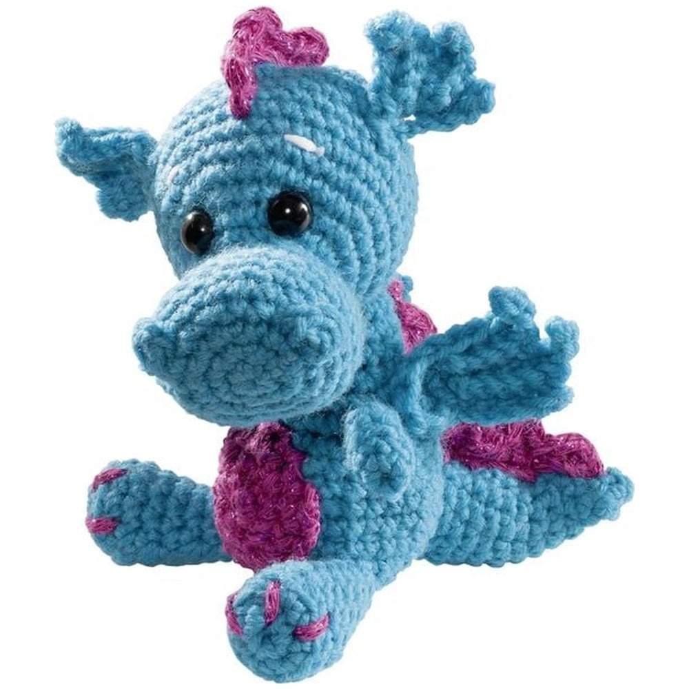 Blue dragon stuffed animal from Folia's Mini Crochet Kit featuring a purple nose, pink feet, and a heart on its head.