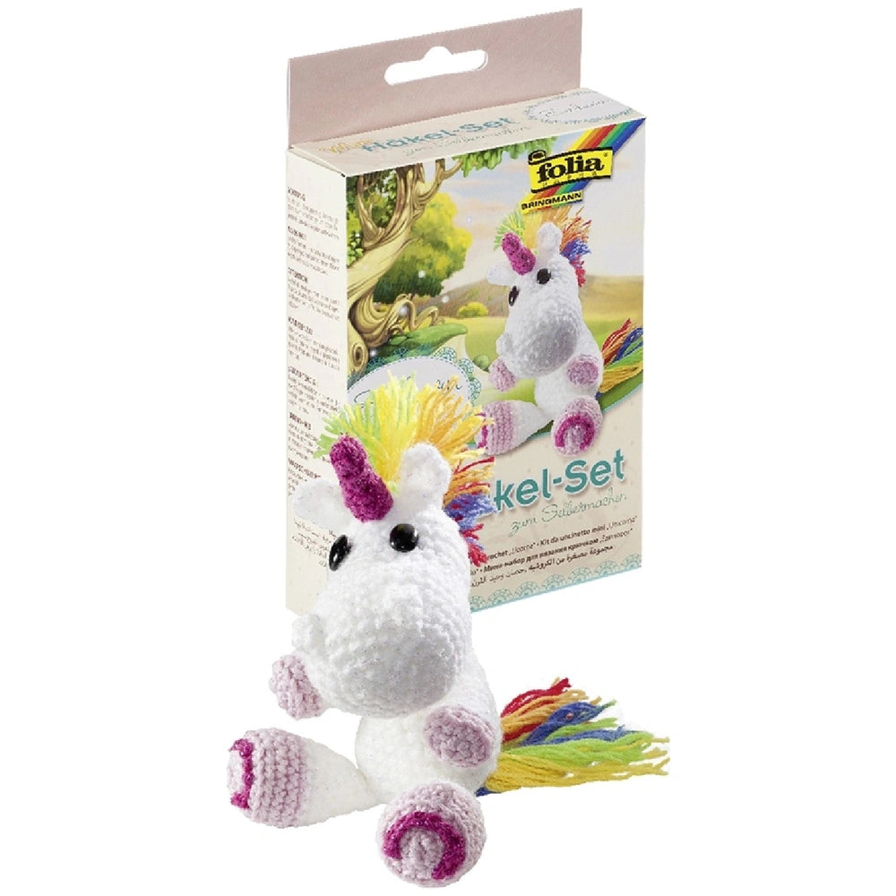 Folia Mini Crochet Kit features a plush unicorn with a colorful mane in a white box with a transparent window and printed tex