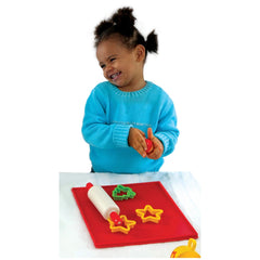 Gowi Baking Set Salzburg 8 Pieces features a smiling child in a blue sweater, holding a red object on a white surface.