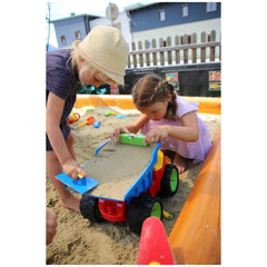 Gowi Design Bricklaying Set features two girls in colorful dresses playing with bright plastic sand toys in a sandy sandbox.