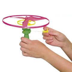Twirly Flying Propeller Toy in pink and yellow plastic, featuring a green handle, yellow string, and a yellow wheel.