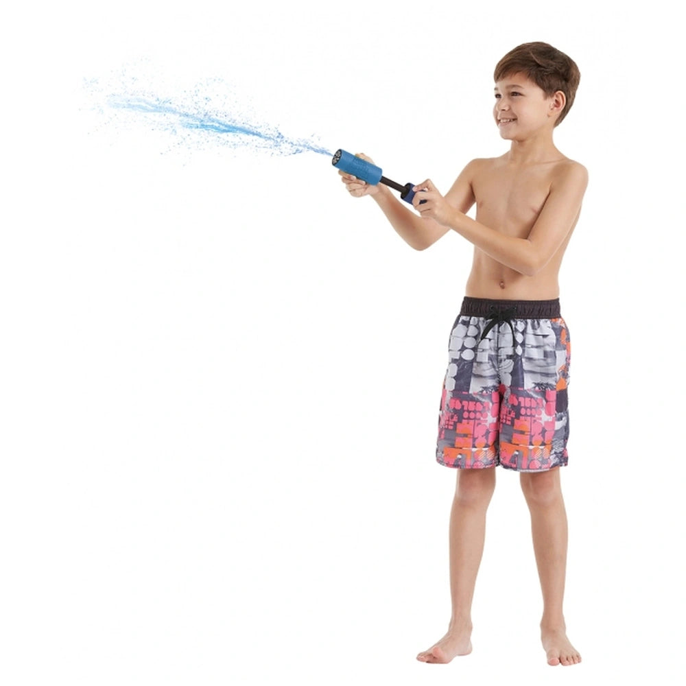 Happy People foam shooter water gun held by a smiling boy in floral shorts, spraying water in the air.