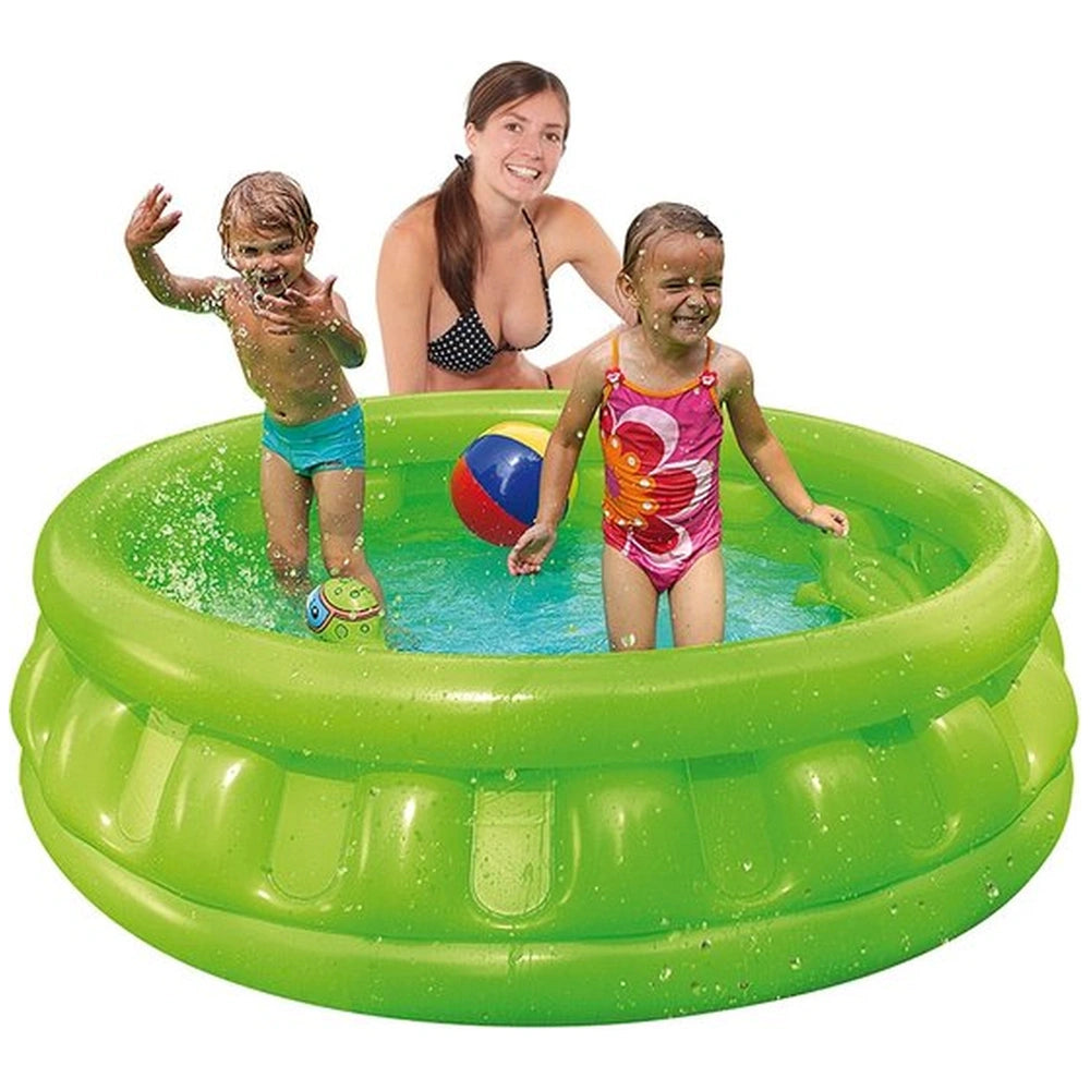 Happy People green inflatable ring with multi-colored ball, woman in black and white bikini, girl in pink swimsuit, boy in bl