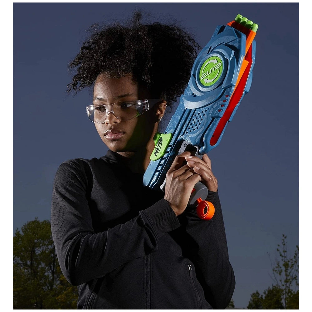 a person in a black jacket holding a blue and orange Hasbro Nerf Elite 2.0 Flipshots Flip-8 Blaster against a dark background