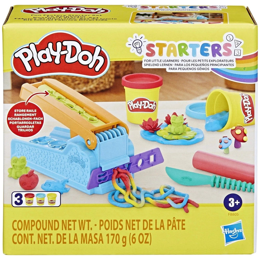 Play-Doh Fun Factory Starter Set packaging features a blue and orange press, knife, accessories, and colorful text on a yello