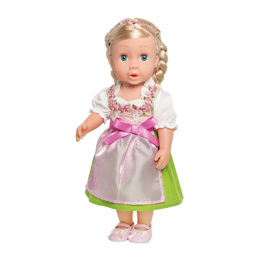 Heless Dirndl Heidi doll features a glossy white dress with a pink apron, green trim, and blonde hair with blue eyes.