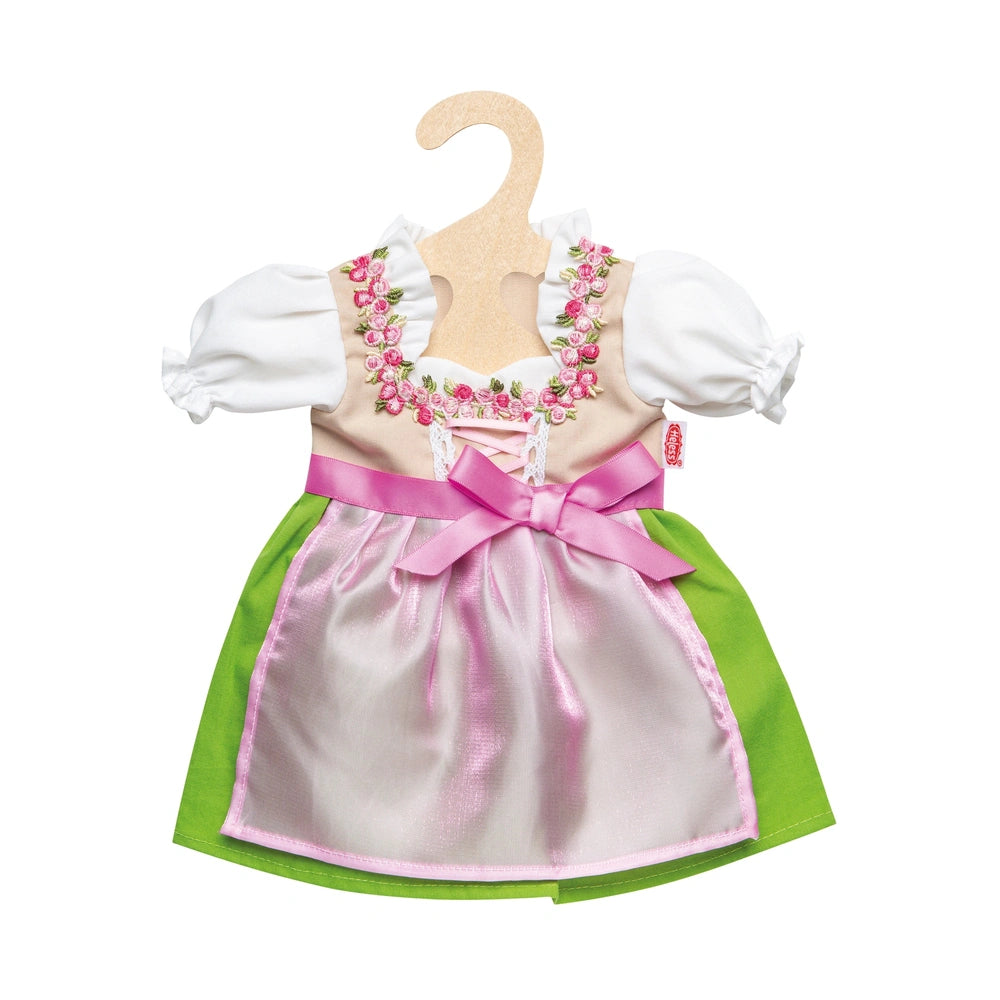 Heless Dirndl Heidi doll dress features a pink bodice, white collar, lace trim, and green skirt with a pink bow at the waist.