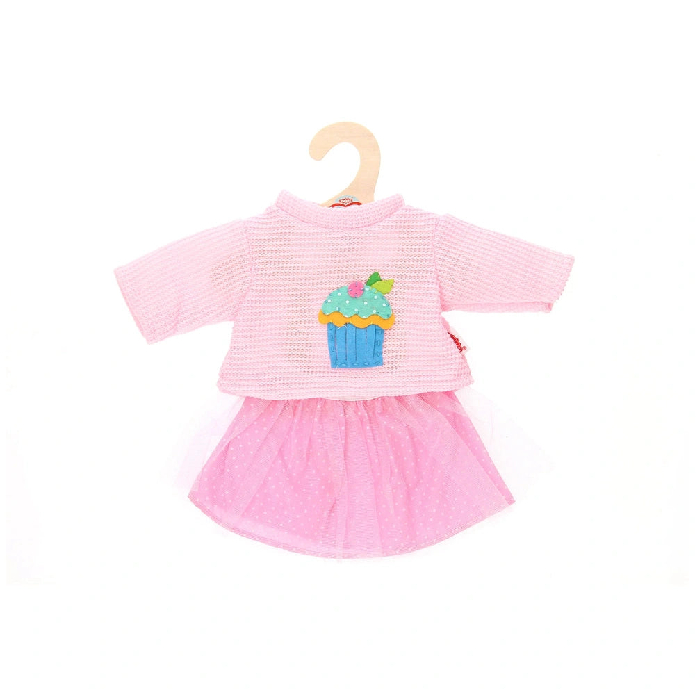 Heless pink sweater and cupcake skirt for dolls, featuring a blue and green cupcake design, short sleeves, and a wooden hange