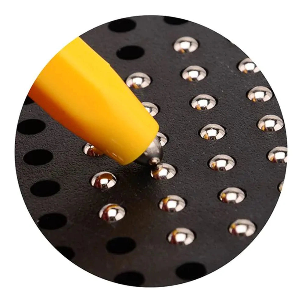 Johntoy Magnetic Drawing Board Playset features a yellow pointed tool on a textured black surface with circular holes.
