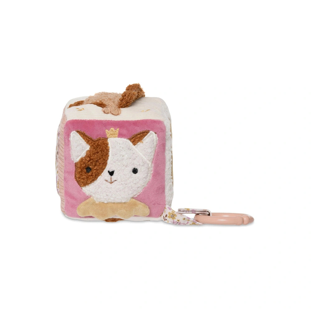 Jollein Activity Cube features a plush cat toy with a crown, pink floral keychain, and textured fabric on a light background.
