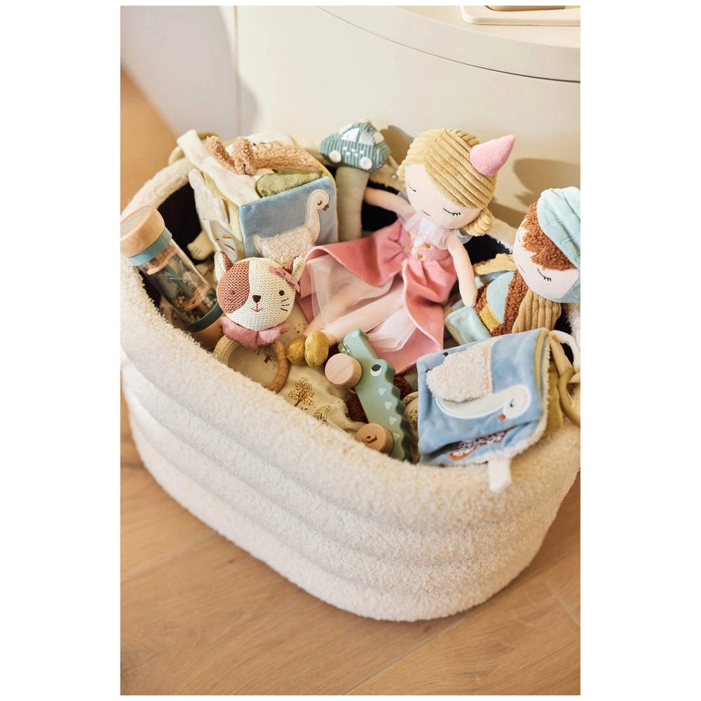 Jollein Activity Cube Tiny Park on a wooden floor surrounded by colorful stuffed animals and a dollhouse with accessories.