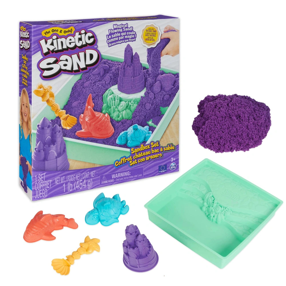 Kinetic Sand Sandbox Set features purple moldable sand with a castle, fish, and shark, ideal for children aged 3 and up.