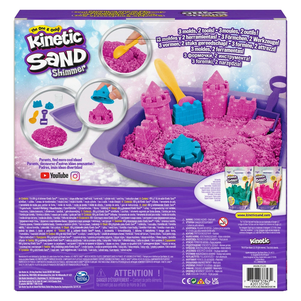 Kinetic Sand Shimmer Sparkle Sandcastle Set in clear tray with purple base, featuring pink sand and glossy packaging.