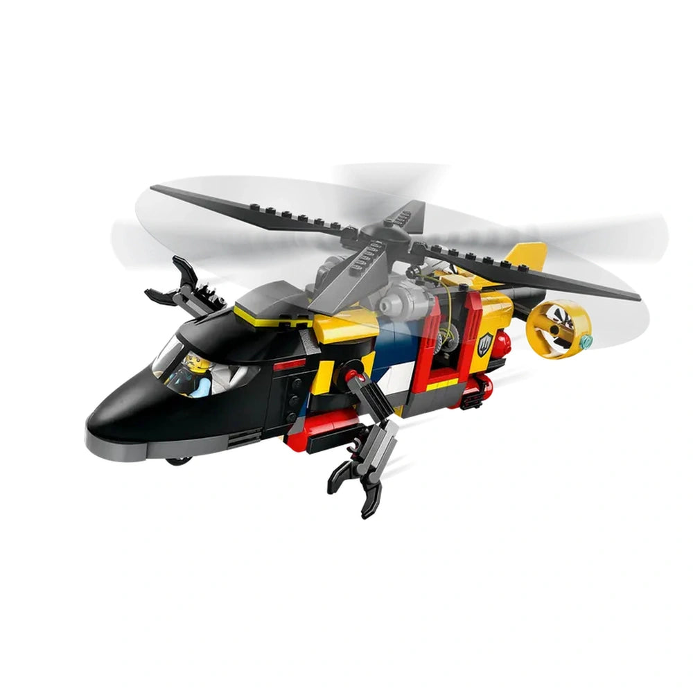 LEGO City black helicopter with spinning rotors, detailed cockpit, and movable claw arms, designed for imaginative play.