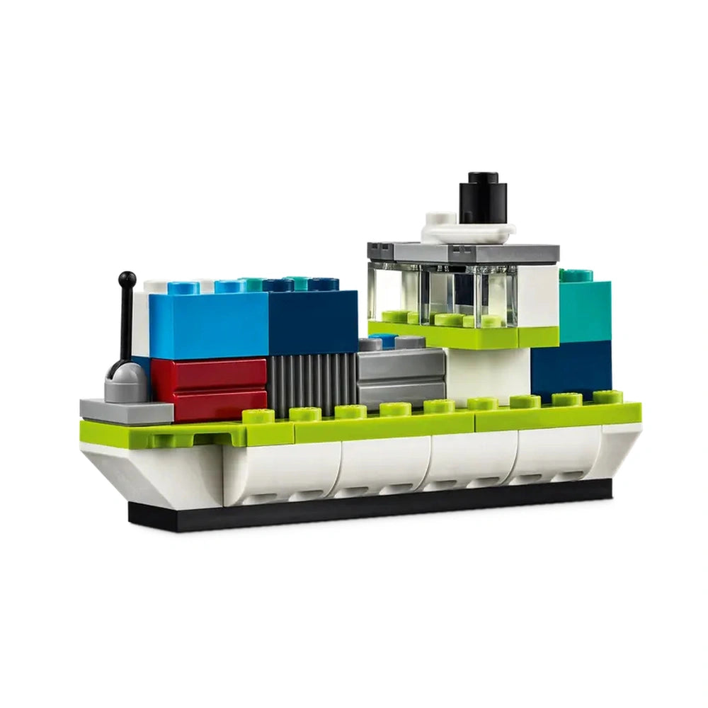 Colorful LEGO® construction set featuring a creatively designed ship, showcasing blue, green, red, and gray bricks, detailed with a transparent cabin and an antenna.