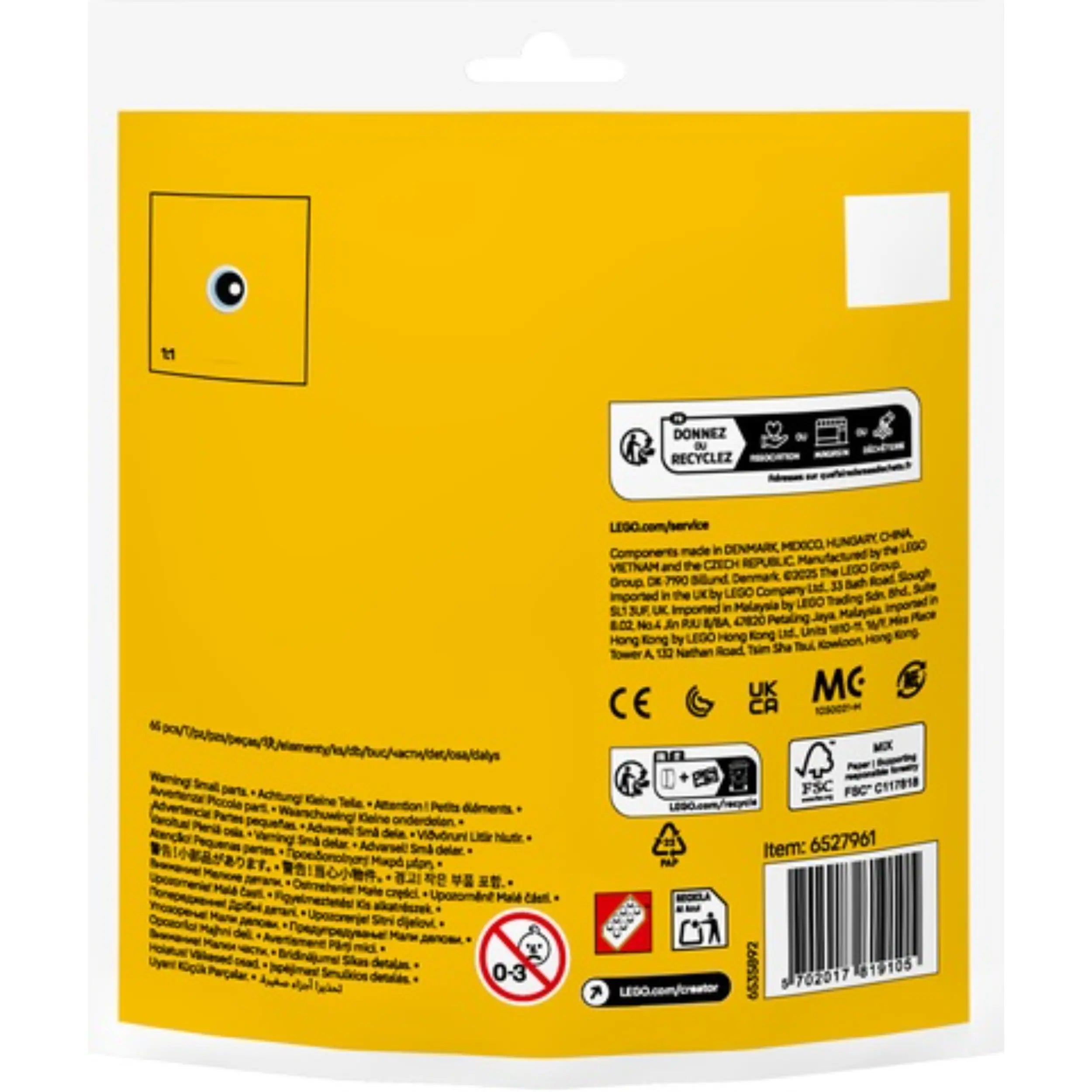 Bright yellow packaging for the LEGO Creator Easter Egg Chick Painting Fun construction set, featuring product details and safety warnings.
