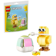 LEGO Creator Easter Egg Chick with a paintbrush standing beside a colorful egg. Features a yellow chick and paint items on a bright background.