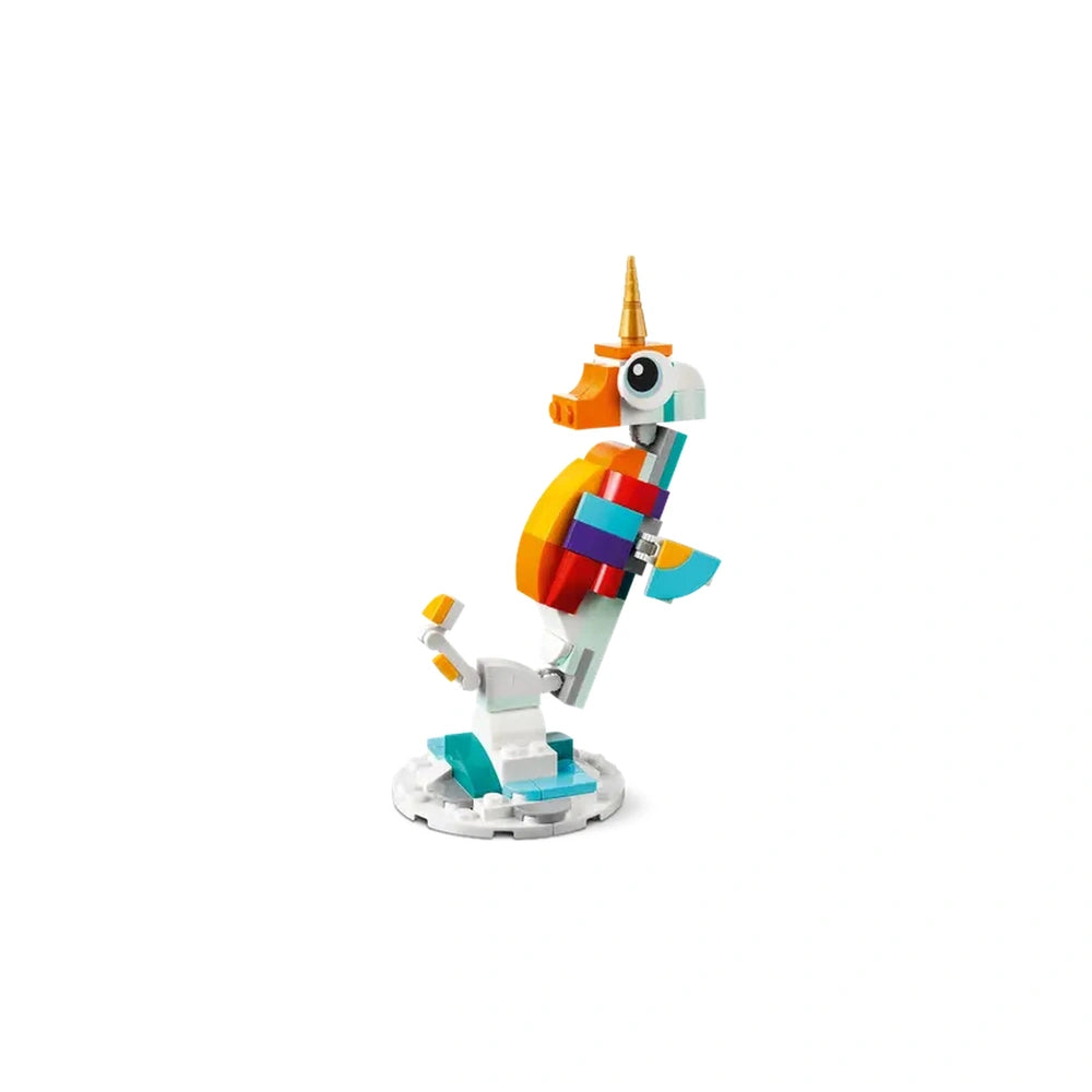 Colorful LEGO unicorn stands on a round white base, featuring a golden horn, vibrant tail, and posable legs, showcasing creativity.