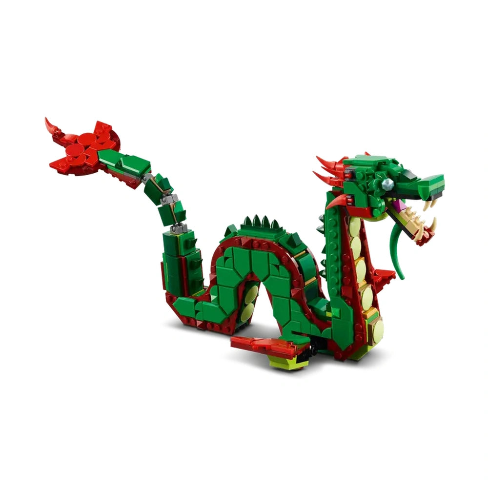 A vibrant LEGO® Creator Medieval Dragon model in green and red, featuring posable wings and limbs, and intricate details.